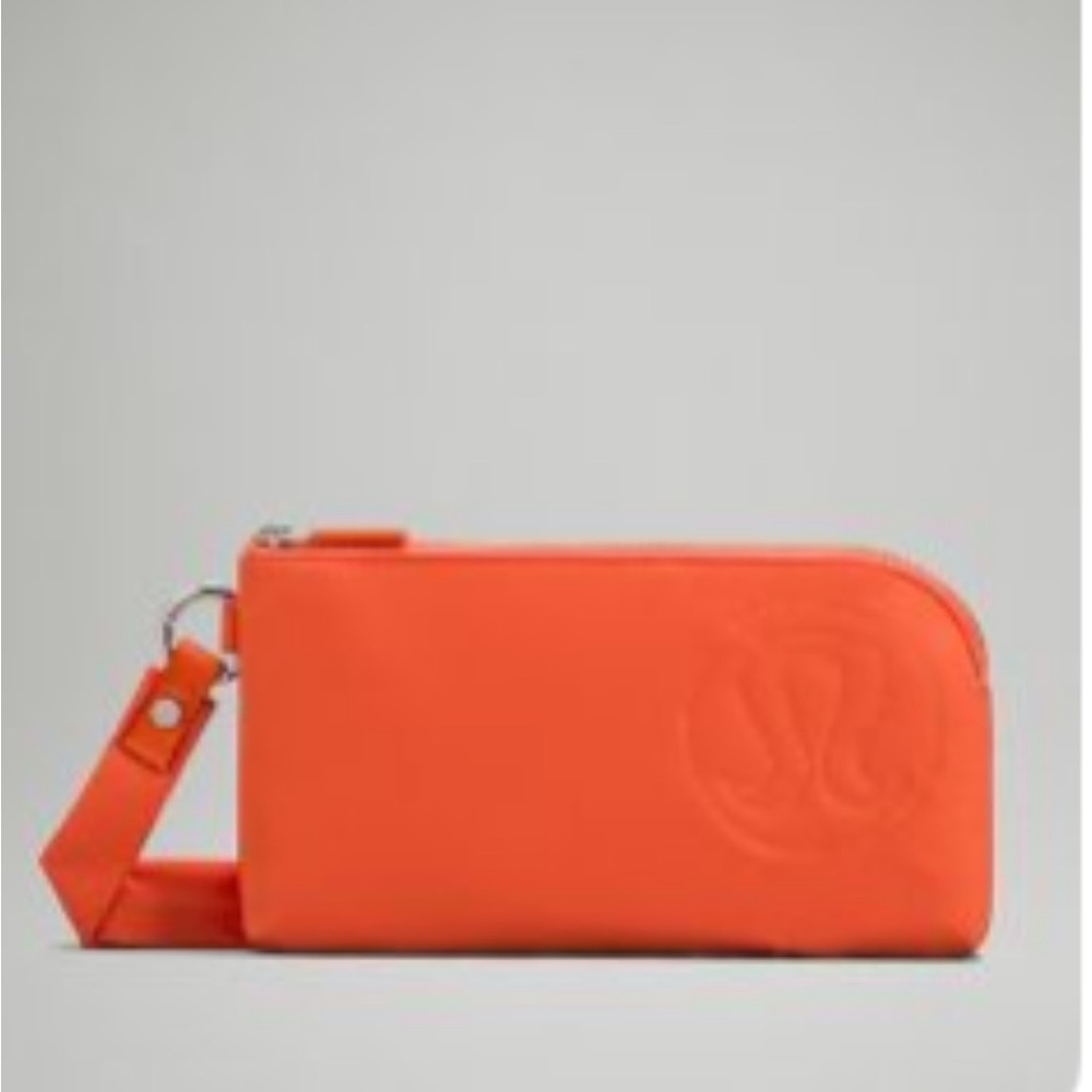 NWOT Lululemon athletica Orange Clutch Wristlet